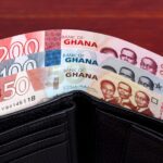 Ghanaian money in the black wallet