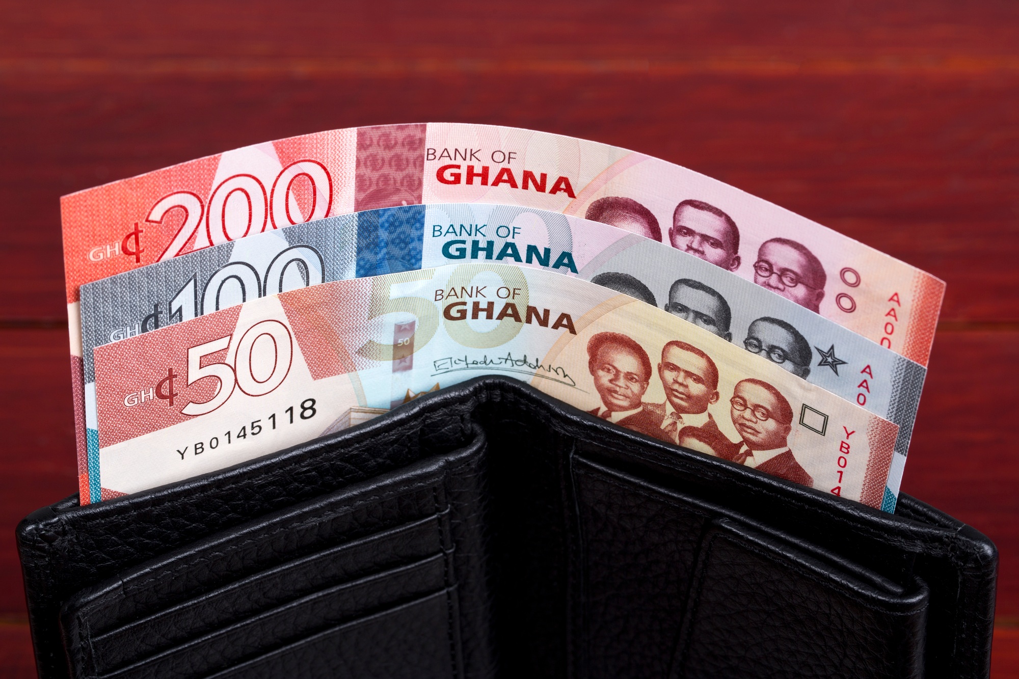 Ghanaian money in the black wallet